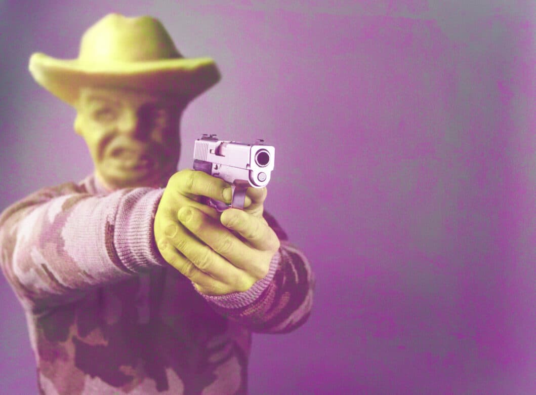 Attempted Murder Charges Can be Difficult to Prosecute in Vista, California 1 A yellow man in a cowboy hat holding a gun