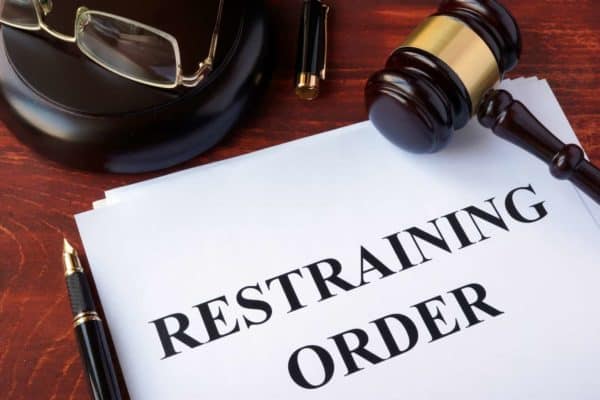 Vista and San Diego Restraining Order Attorney: TRO & PRO 1 Paper saying "restraining order" with a gavel and glasses