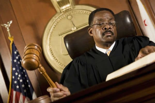 What Does it Mean to Instruct Jurors in a Trial? 1 A judge reads from a book as he issues jury instructions