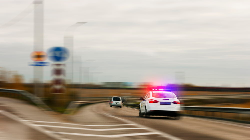 What to do if You're Accused of Evading the Police in California 1 A white SUV is evading the the police, a crime under California 2800.1 (VC)