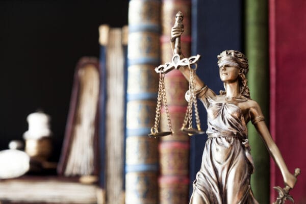 The Criminal Process In San Diego, California 15 The scales of justice in front of books